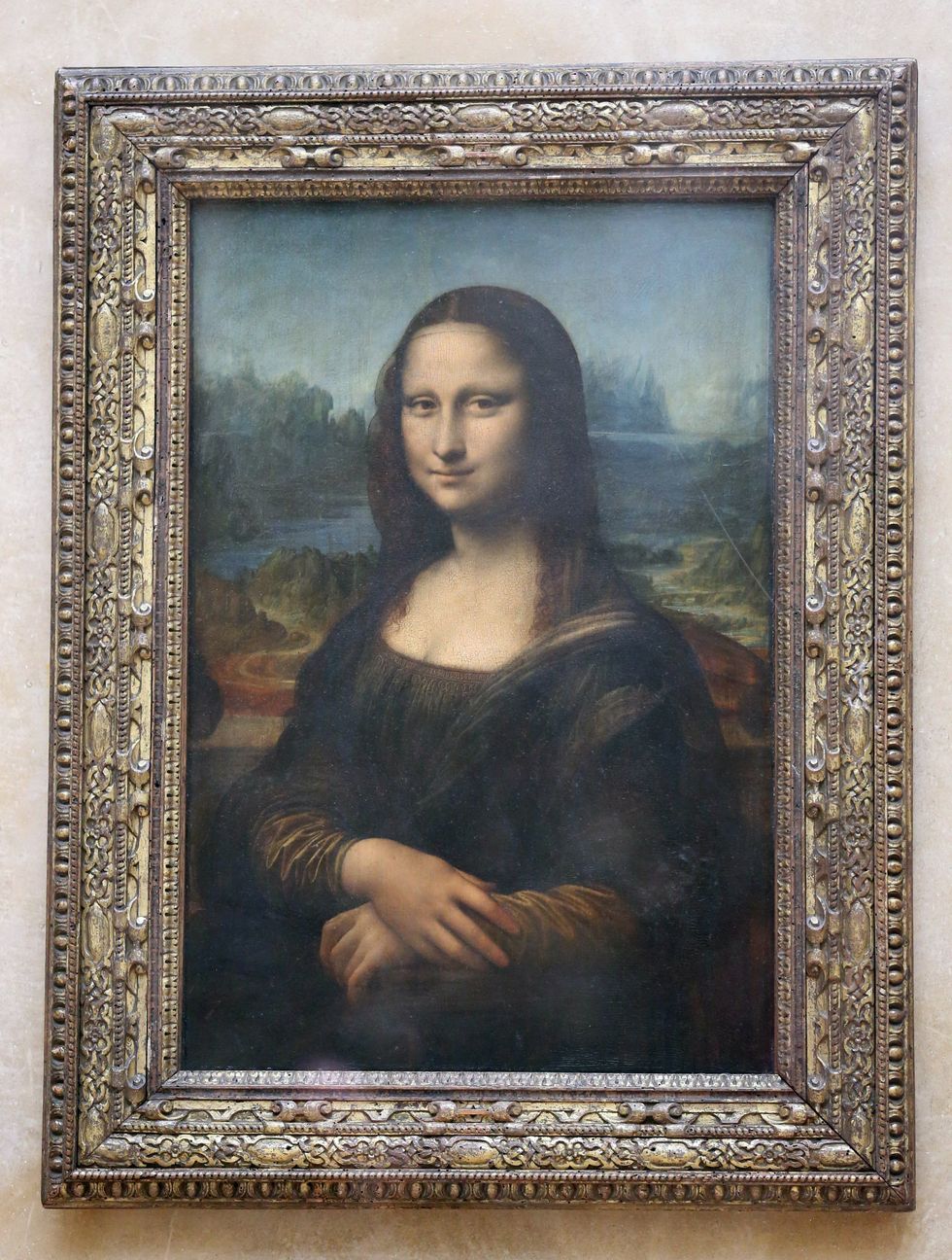 Leonardo Da Vinci's Mona Lisa displayed in the Louvre Museum