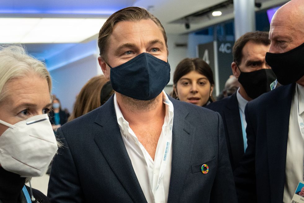Leonardo DiCaprio walks through the exhibition hall after attending an event at the Cop26 summit in Glasgow.