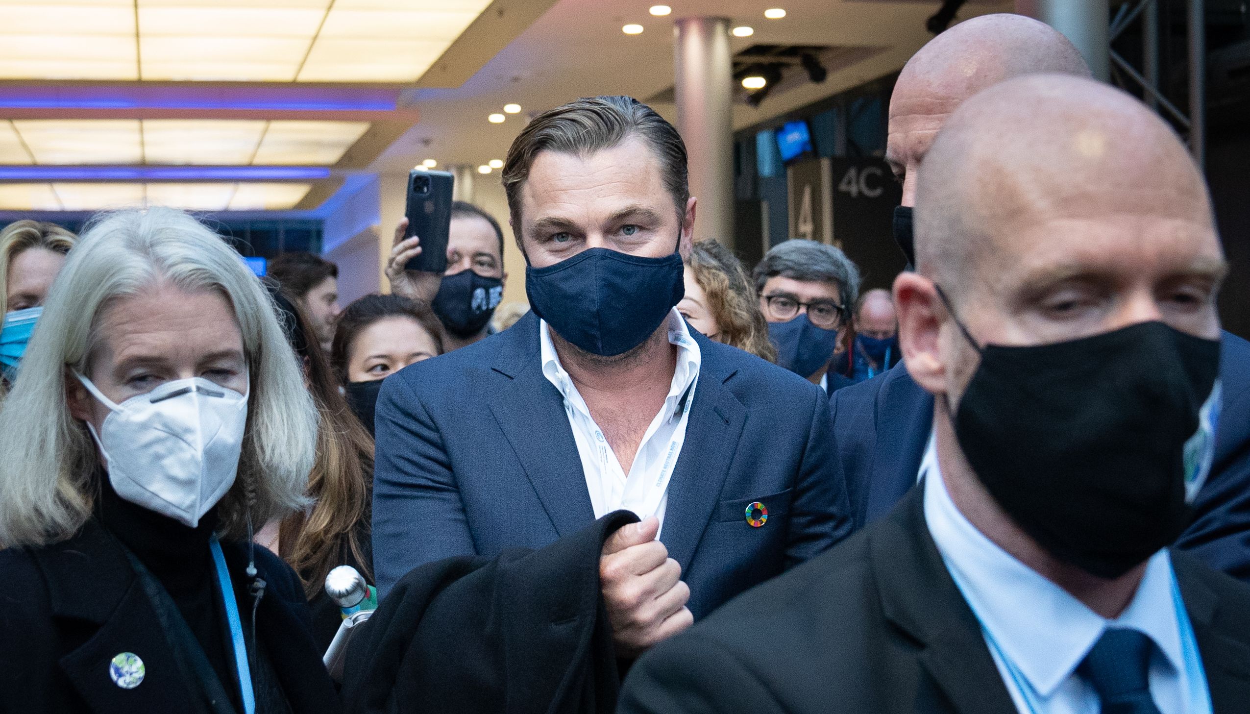 Leonardo DiCaprio walks through the exhibition hall after attending an event at the Cop26 summit in Glasgow.