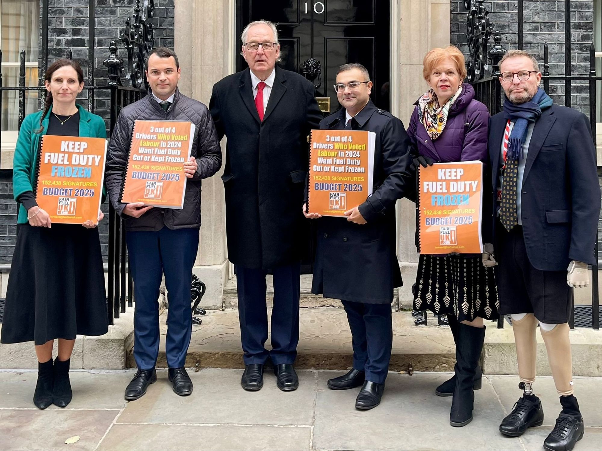 Lewis Cocking MP, FairFuelUK founder Howard Cox and Craig Mackinlay MP deliver a fuel duty petition to 10 Downing Street