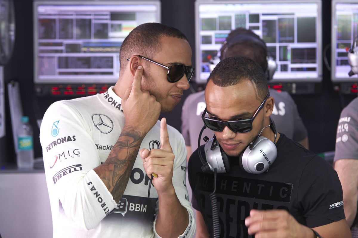 Lewis Hamilton alongside his brother Nicolas