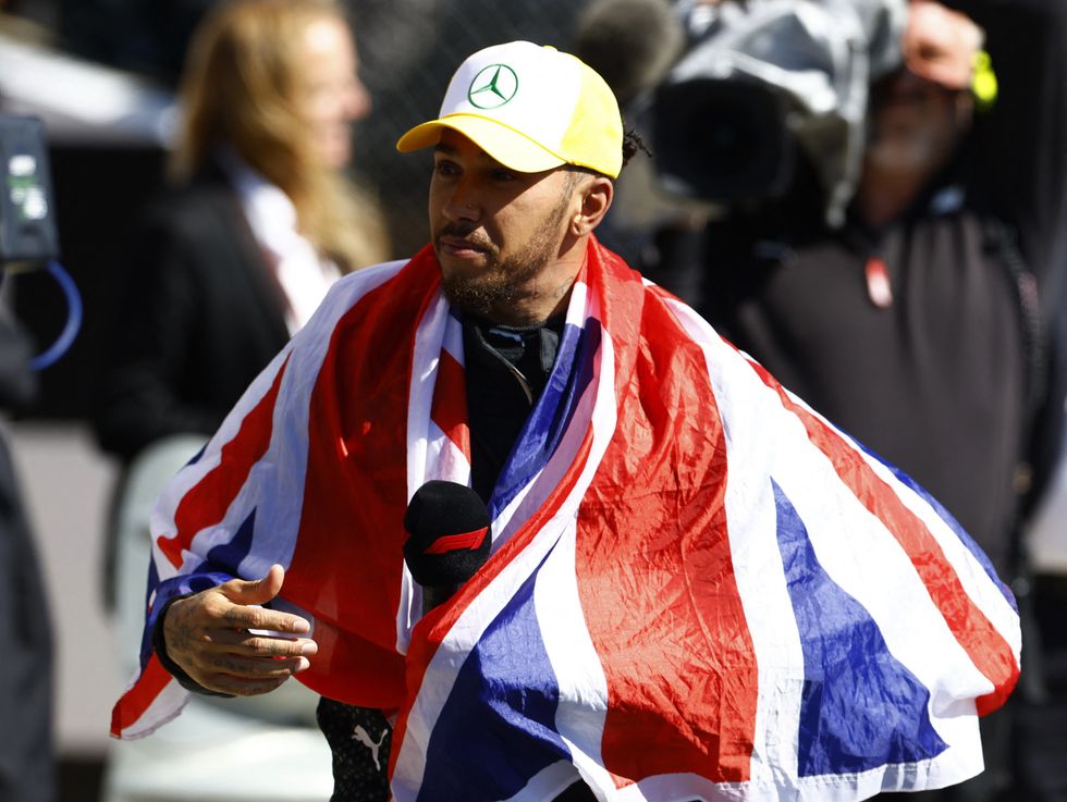 Lewis Hamilton held the Union Jack flag aloft after his win