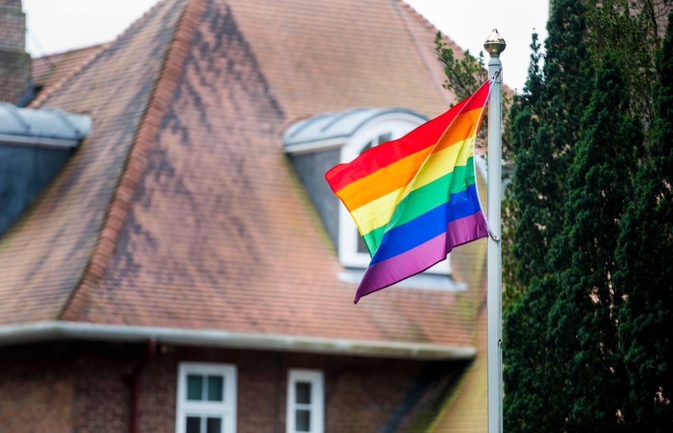 LGBT flag flying in the wind.