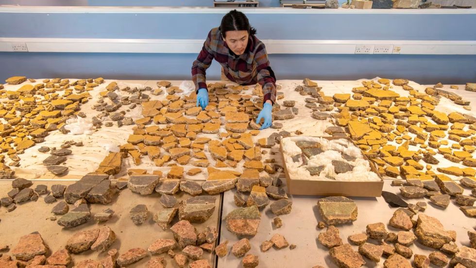 Li undertook the task of arranging the delicate fragments