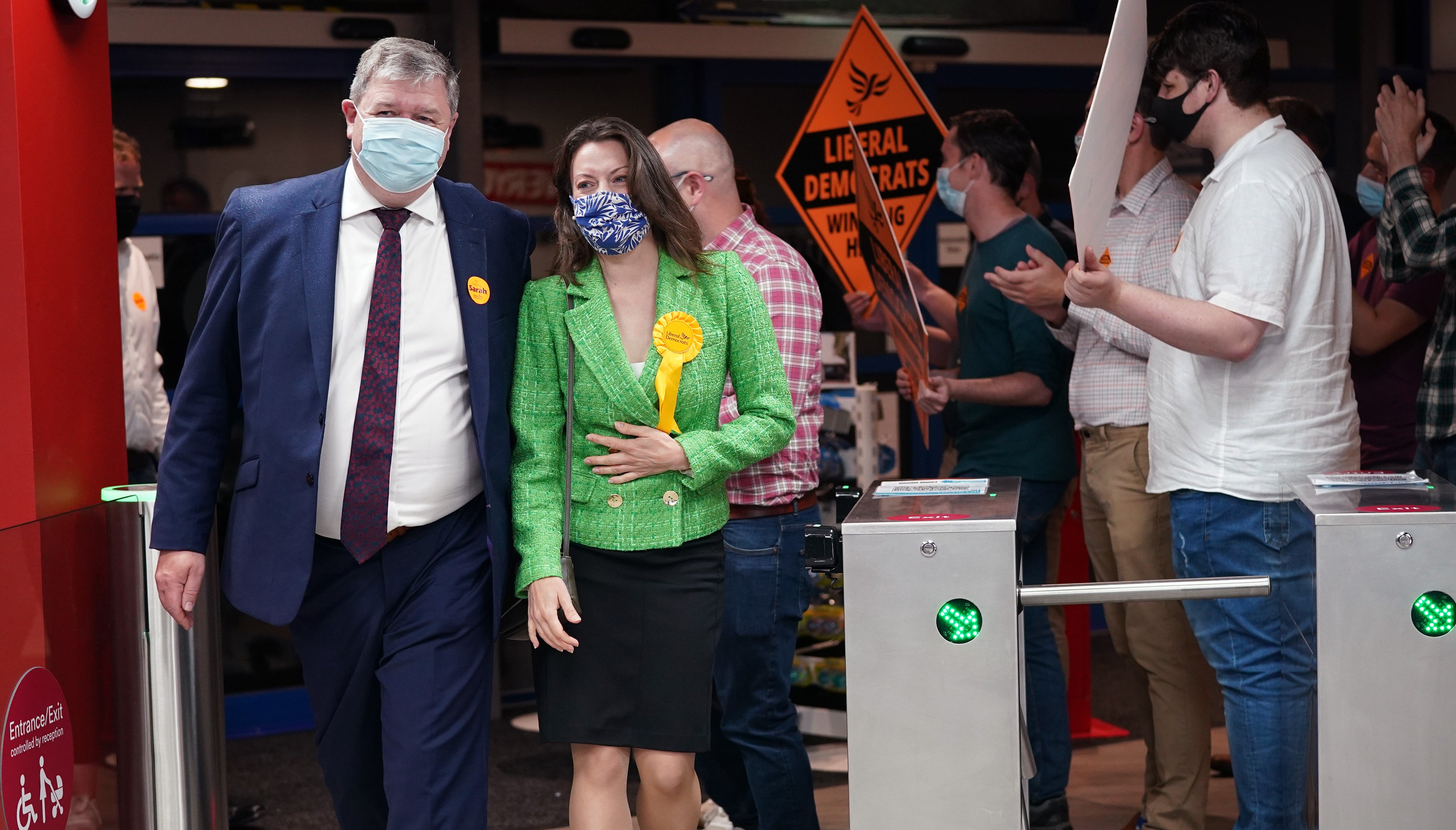 Liberal Democrat candidate Sarah Green and Alistair Carmichael, Liberal Democrat MP for Orkney and Shetland, are greeted by party supporters upon arriving for the declaration in the Chesham and Amersham.