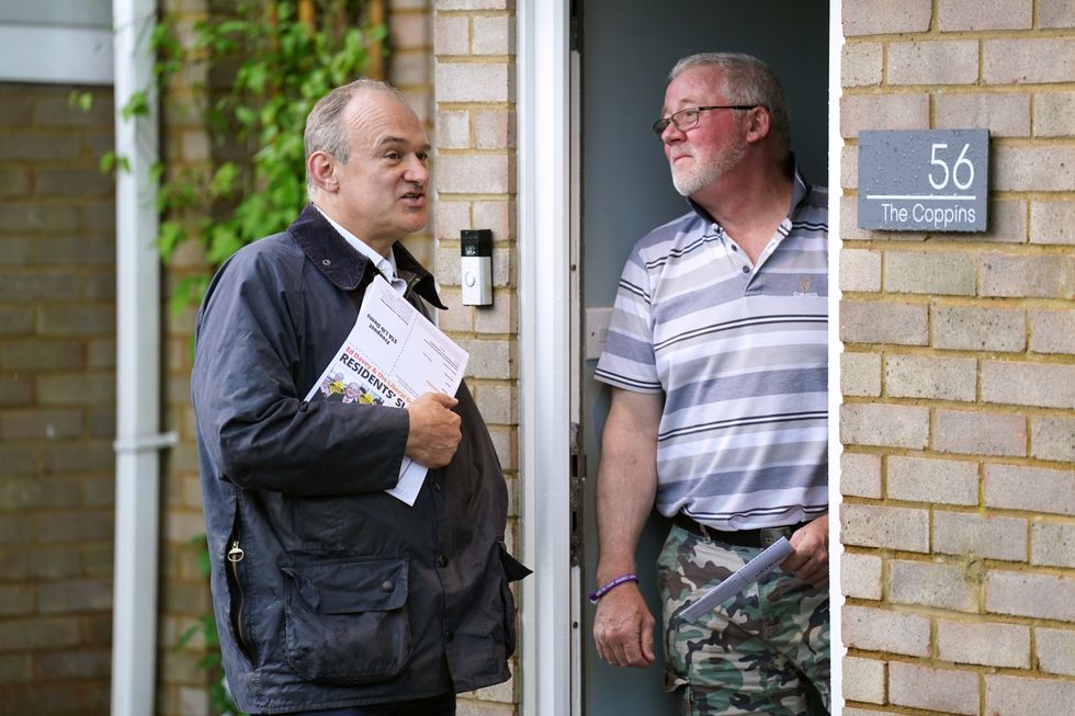 Liberal Democrat leader Sir Ed Davey speaks to residents in Ampthill
