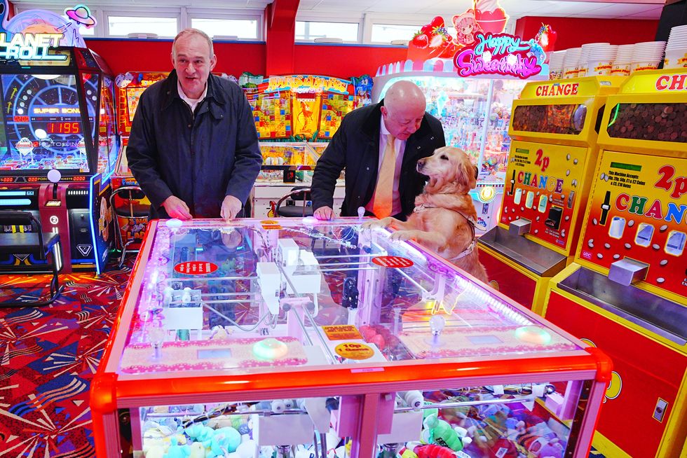 Liberal Democrats leader Sir Ed Davey in Paignton with Torbay MP Steve Darling with his guide dog Jennie,\u200b