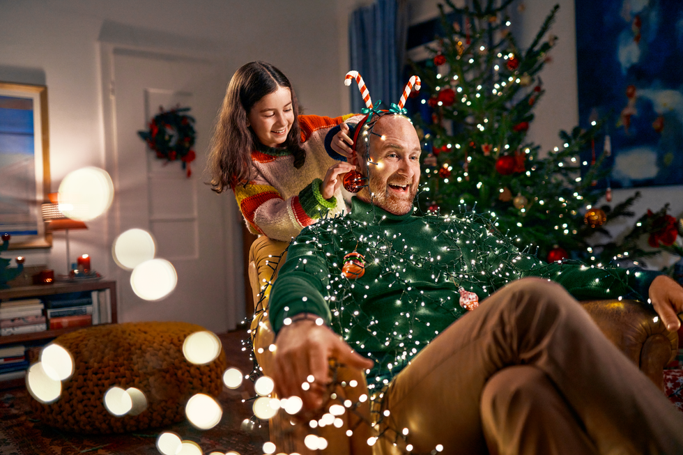 Lidl Christmas advert: Child decorating dad with festive decorations