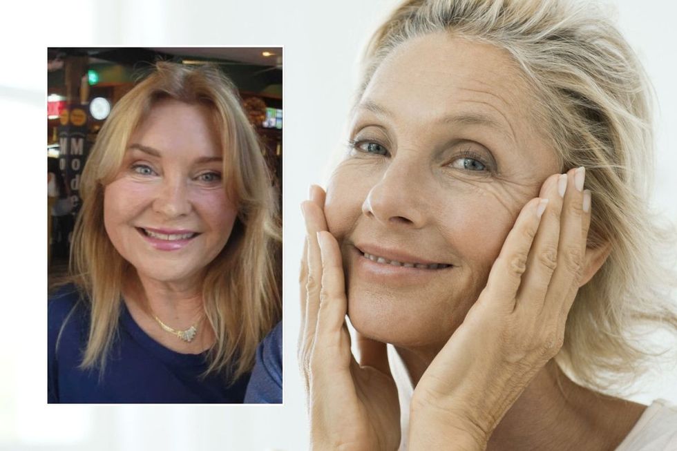 Linda Robison / Woman admiring her face in mirror