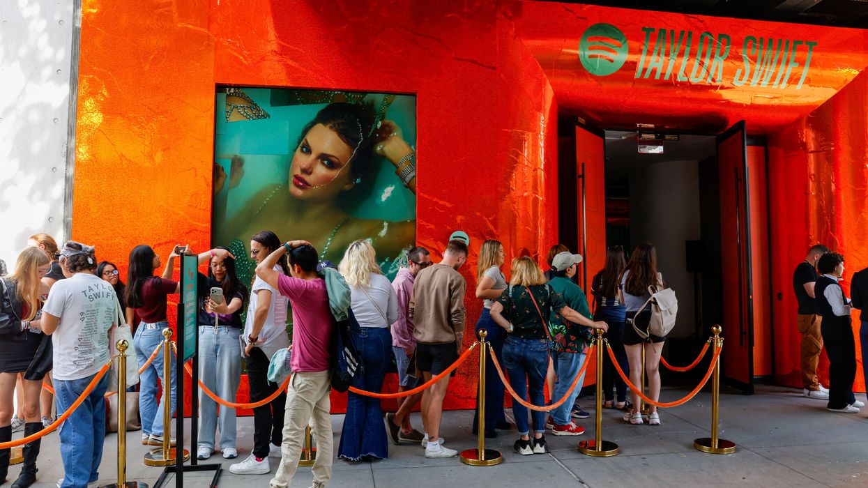 Line of people outside Spotify and Taylor Swift event