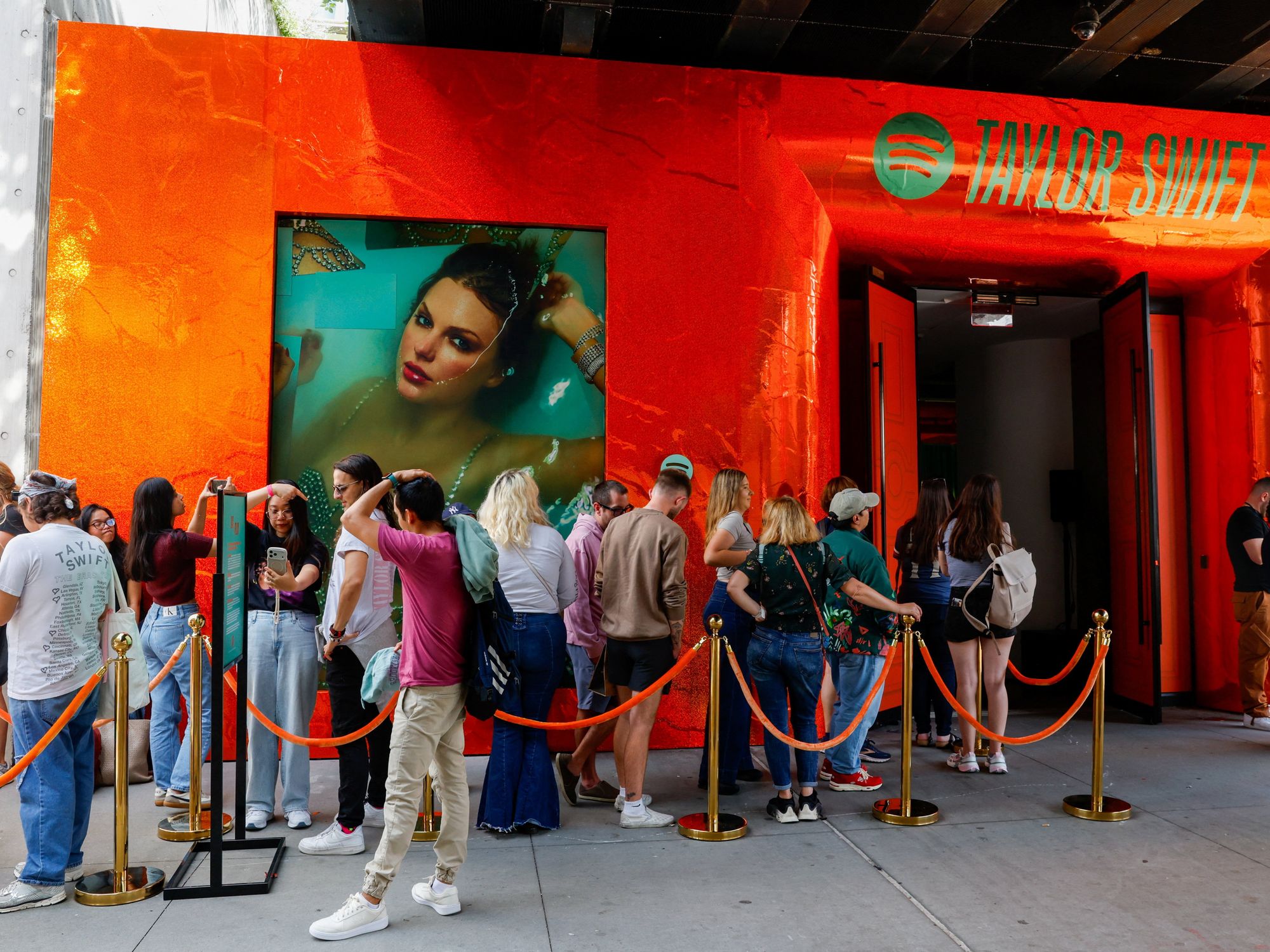 Line of people outside Spotify and Taylor Swift event