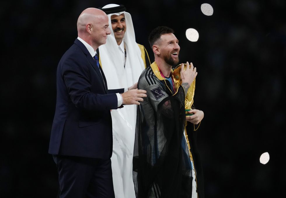Lionel Messi holds the World Cup trophy