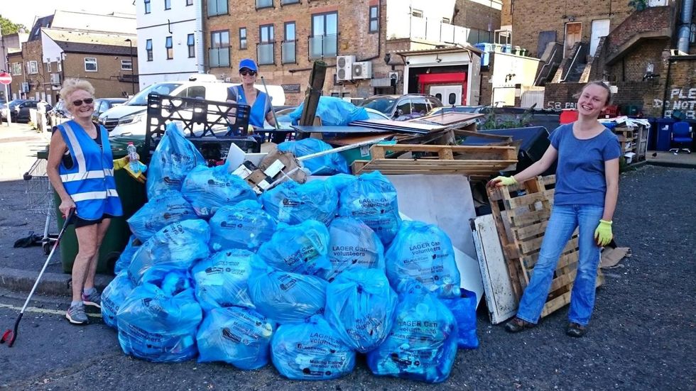 Litter picking volunteers with bags of rubbish