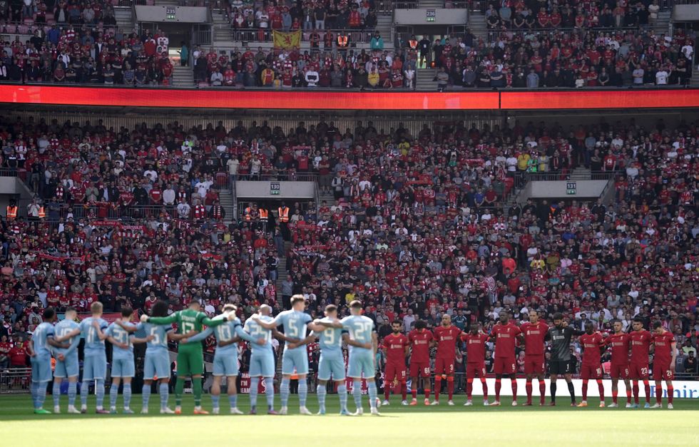 Liverpool fans in the stands as Liverpool and Manchester City players stand for a minute's silence to mark the anniversary of the Hillsborough disaster before the Emirates FA Cup semi final match at Wembley Stadium
