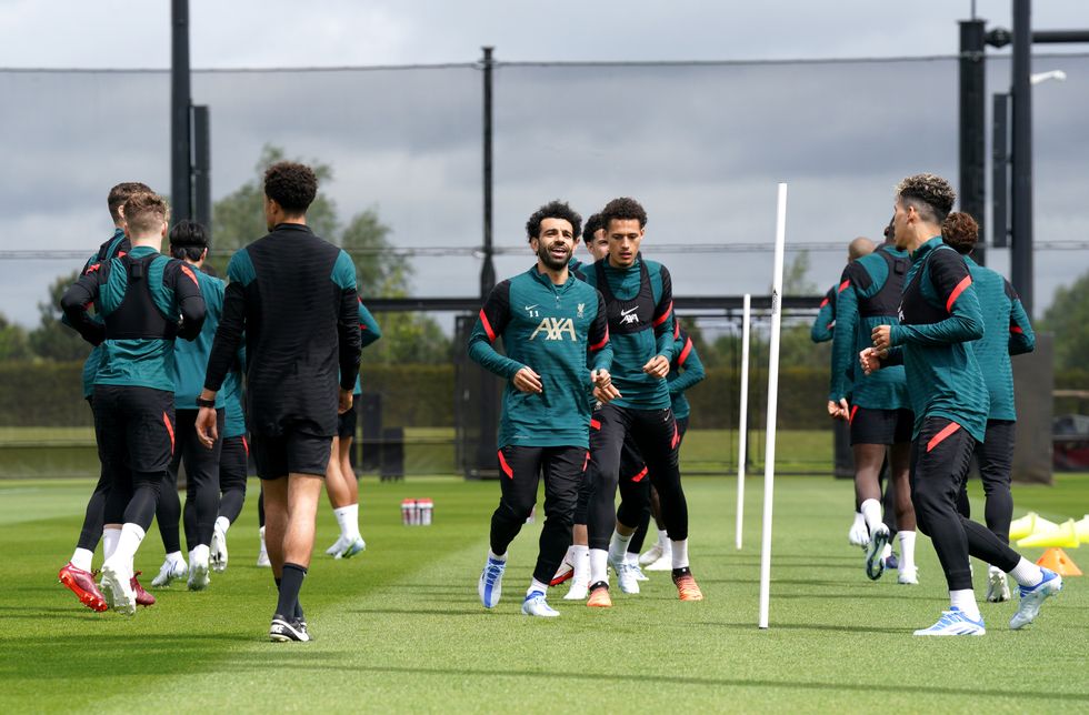 Liverpool's Mohamed Salah (centre) and team-mates warming up during a media day at the AXA Training Centre in Liverpool ahead of the UEFA Champions League Final in Paris on Saturday. Picture date: Wednesday May 25, 2022.