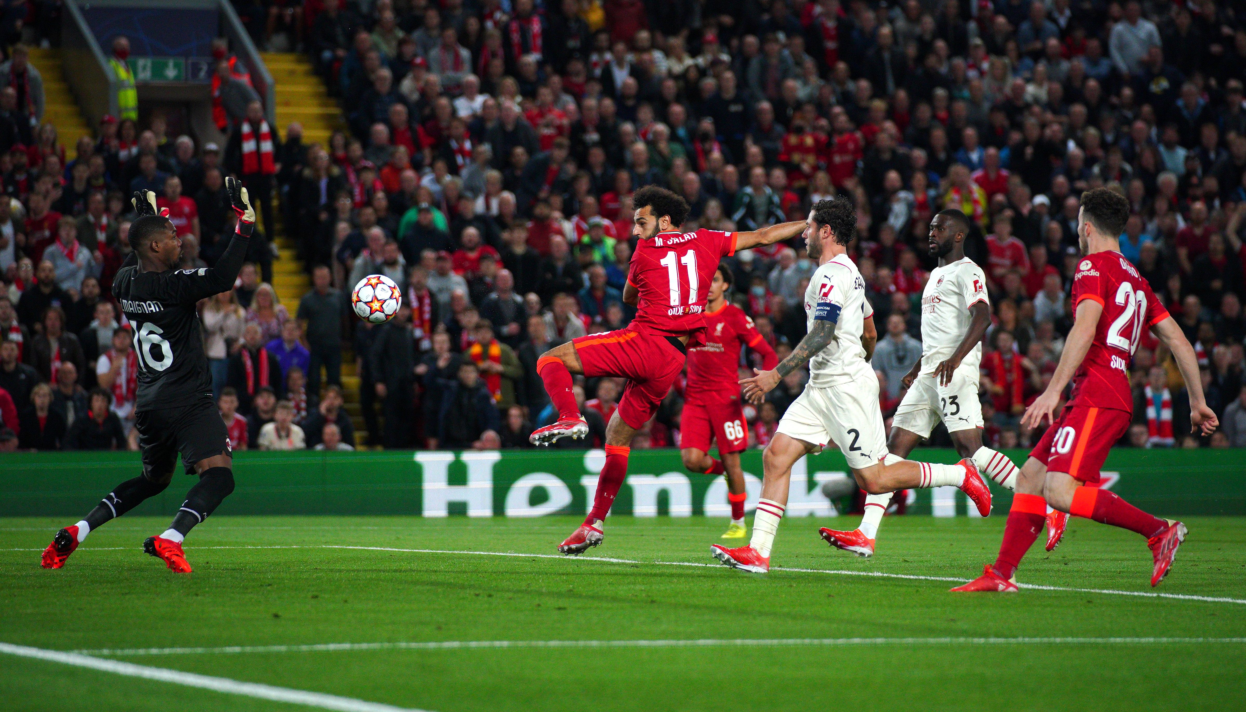 Liverpool's Mohamed Salah (centre) scores their side's second goal of the game during the UEFA Champions League, Group B match at Anfield, Liverpool.