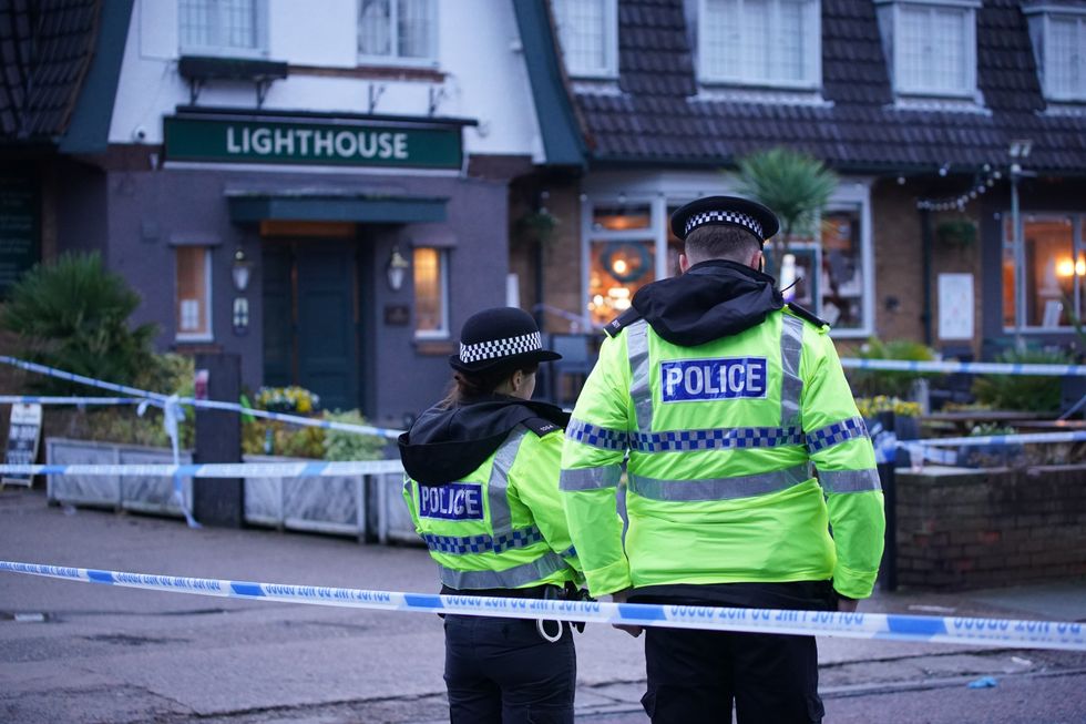 Liverpool shooting: Police officers on duty at the Lighthouse Inn in Wallasey Village