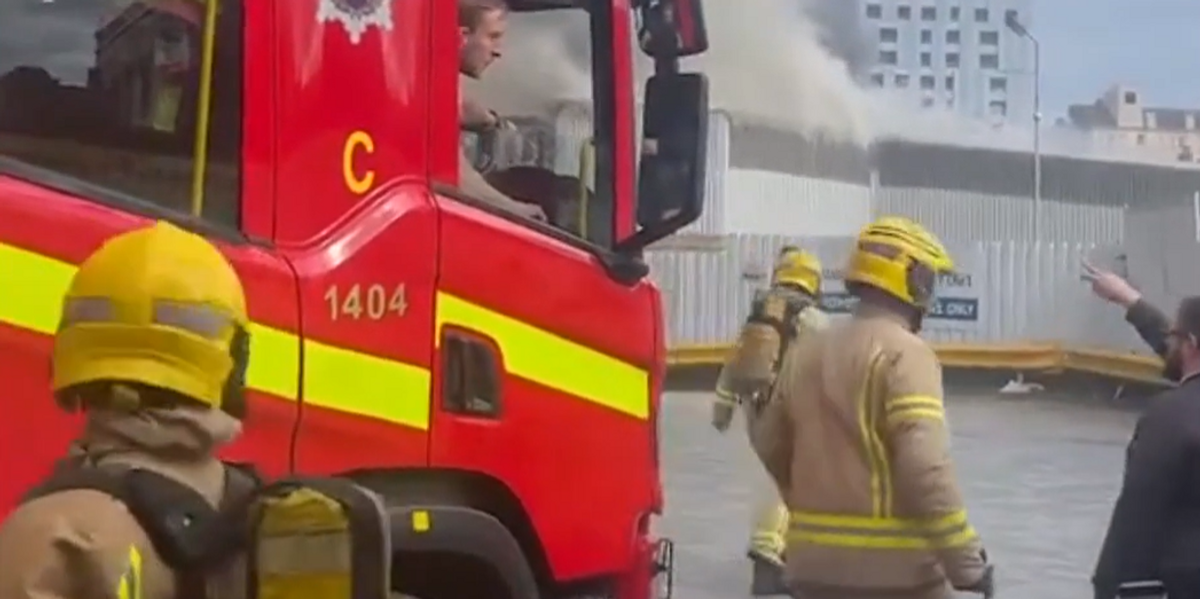 NextImg:Firefighters evacuate major UK train station and shops evacuated as plumes of smoke spark travel chaos