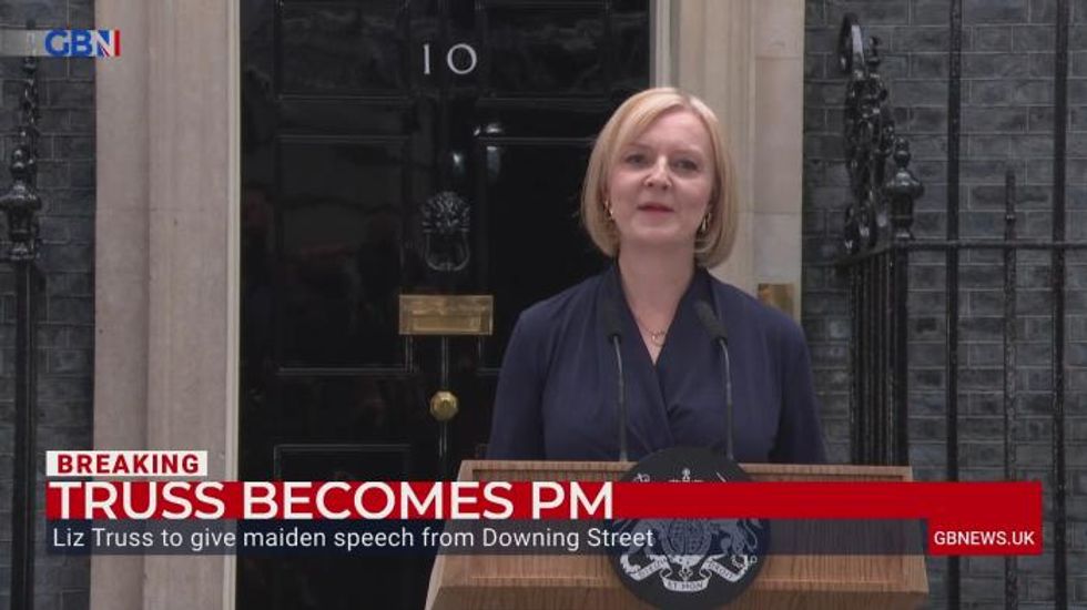 Protesters attempt to interrupt Liz Truss' first speech as Prime Minister by playing Mad World and using air horn