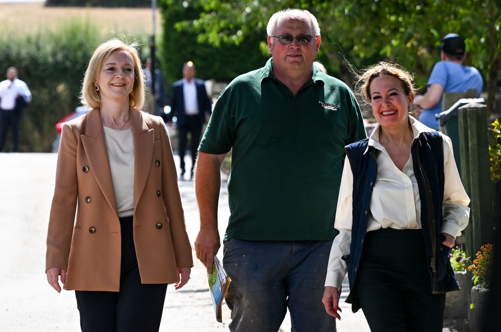Liz Truss with farmer Andrew Gale and Anne Marie Morris (right)