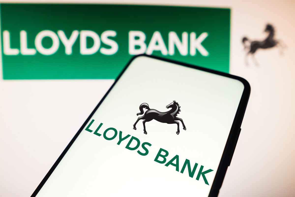 Lloyds Bank logo on mobile and sign
