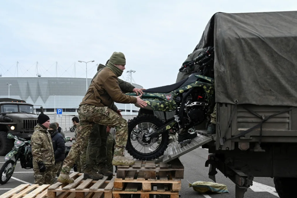 Loading motorbikes for Russian military