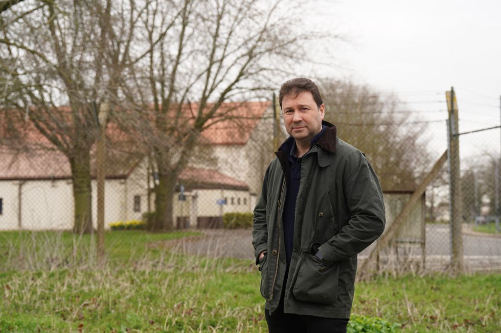Local resident Tony Clarke-Holland poses outside of RAF Wethersfield in Essex
