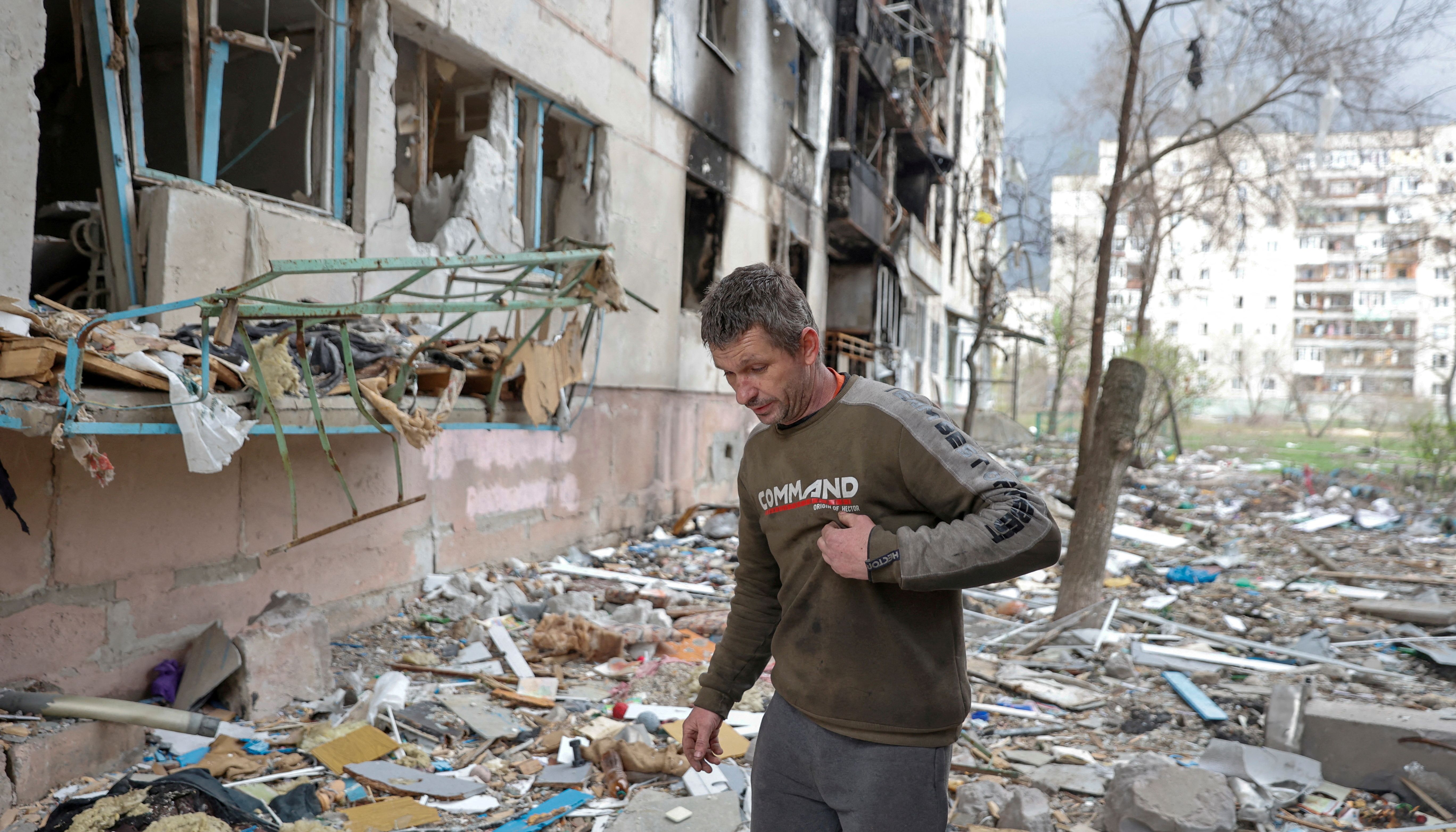 Local resident Viacheslav walks on debris of a residential building damaged by a military strike, as Russia's attack on Ukraine continues, in Sievierodonetsk, Luhansk region, Ukraine.