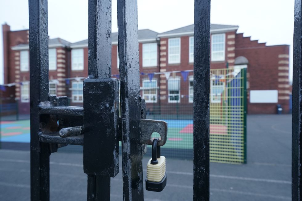 Locked school gates at Rockcliffe First School in Whitley Bay, Tyne and Wear, on the day that Prime Minister Boris Johnson announced the closure of schools and cancellation of exams in the face of the coronavirus pandemic.