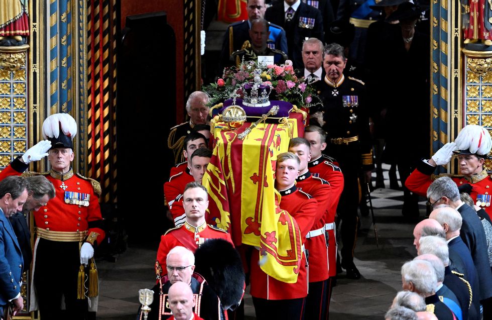 LONDON, ENGLAND - SEPTEMBER 19: The coffin of Queen Elizabeth II with the Imperial State Crown resting on top of it departs Westminster Abbey during the State Funeral of Queen Elizabeth II on September 19, 2022 in London, England. Gareth Cattermole/Pool via REUTERS