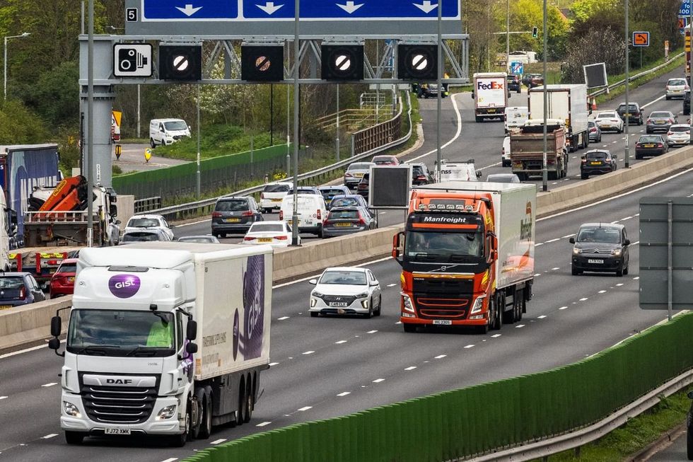 Lorries driving on a motorway near London