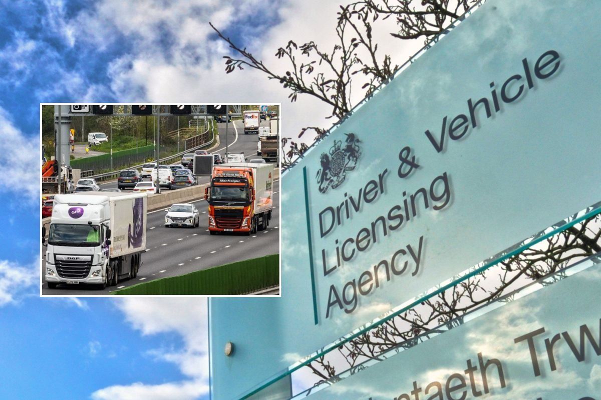 Lorries driving on a road and a DVLA sign