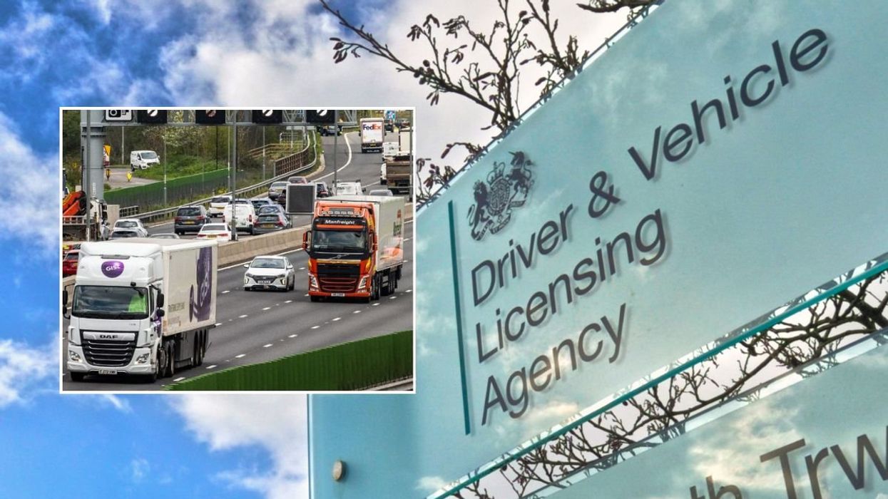 Lorries driving on a road and a DVLA sign