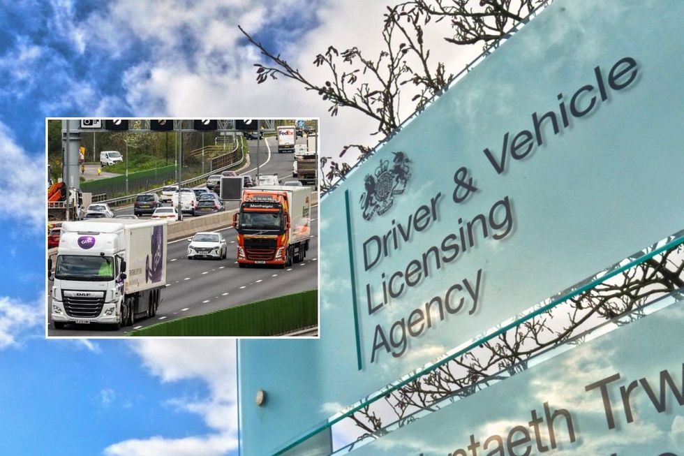 Lorries driving on a road and a DVLA sign