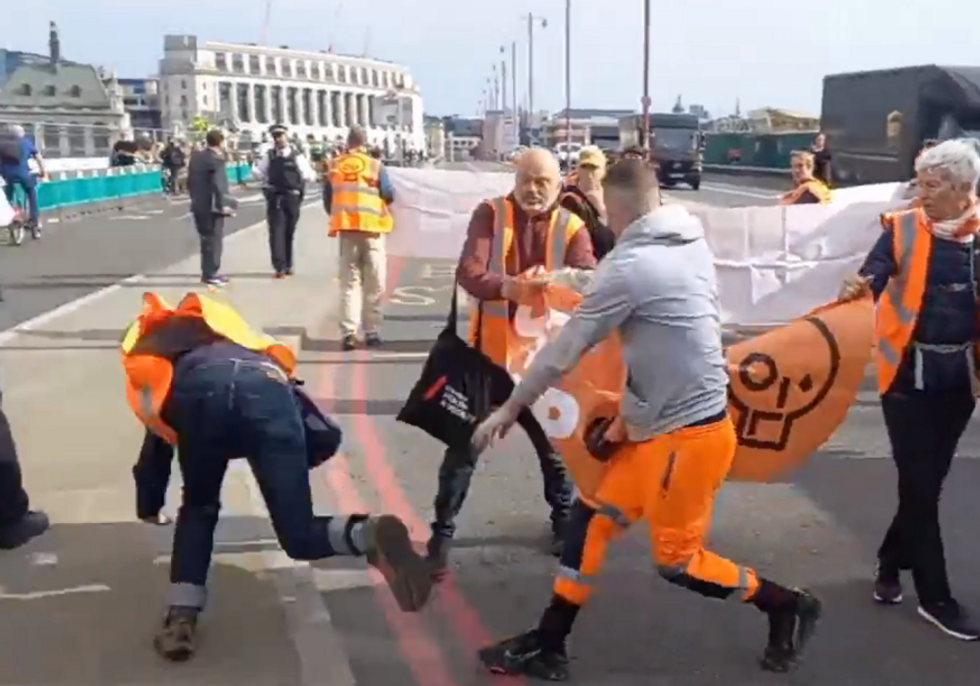 Louis Greaves shoves a Just Stop Oil protester