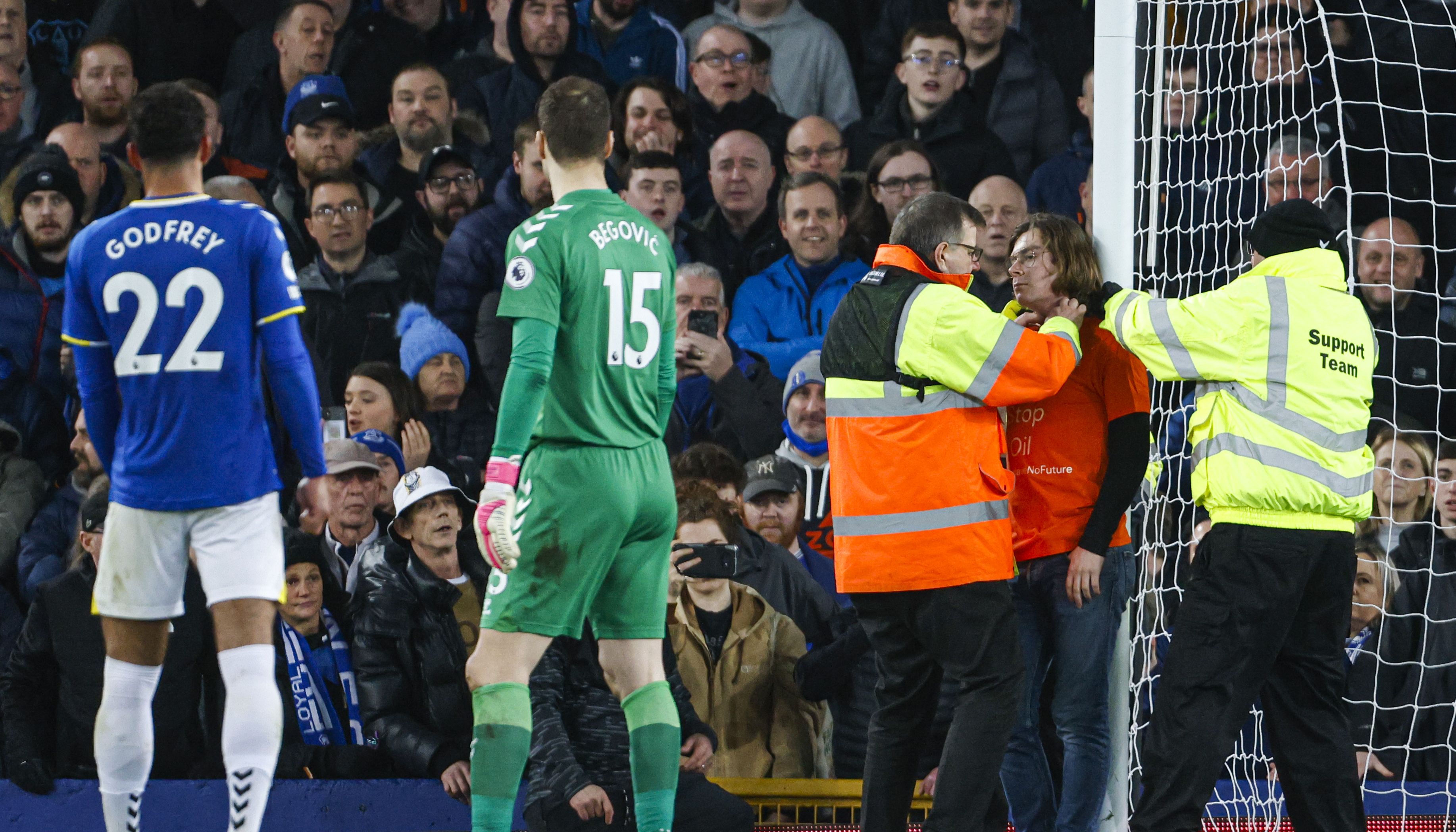 Louis McKechnie ties himself to the goal frame during the Premier League match at Goodison Park, Liverpool. Picture date: Thursday March 17, 2022.