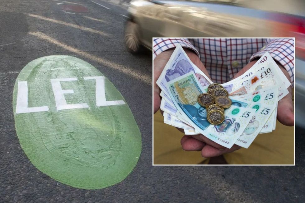 Low Emission Zone sign and hands holding money