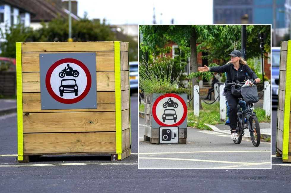 Low Traffic Neighbourhood sign and a cyclist