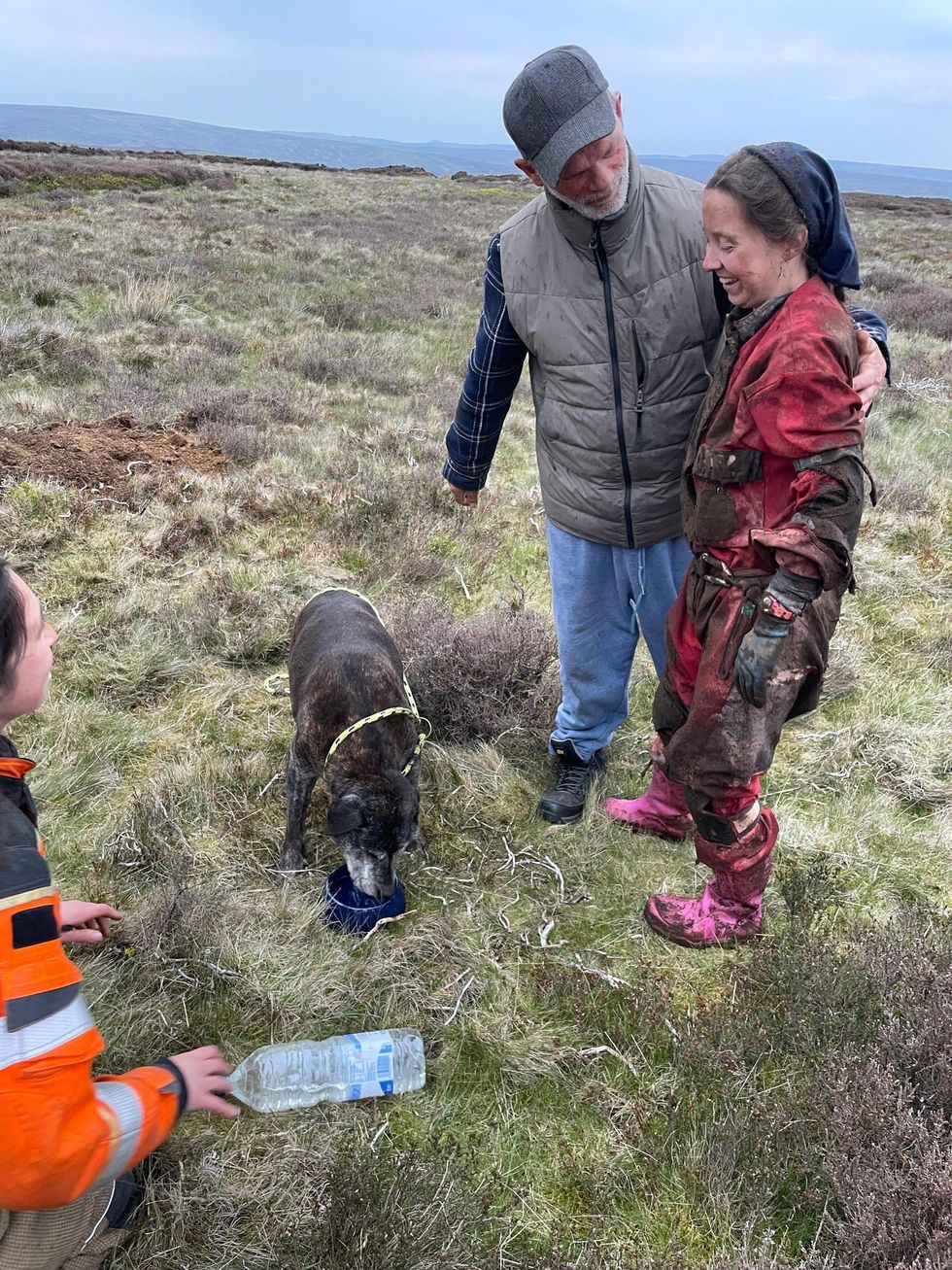 Lucy covered in mud next to Maisy