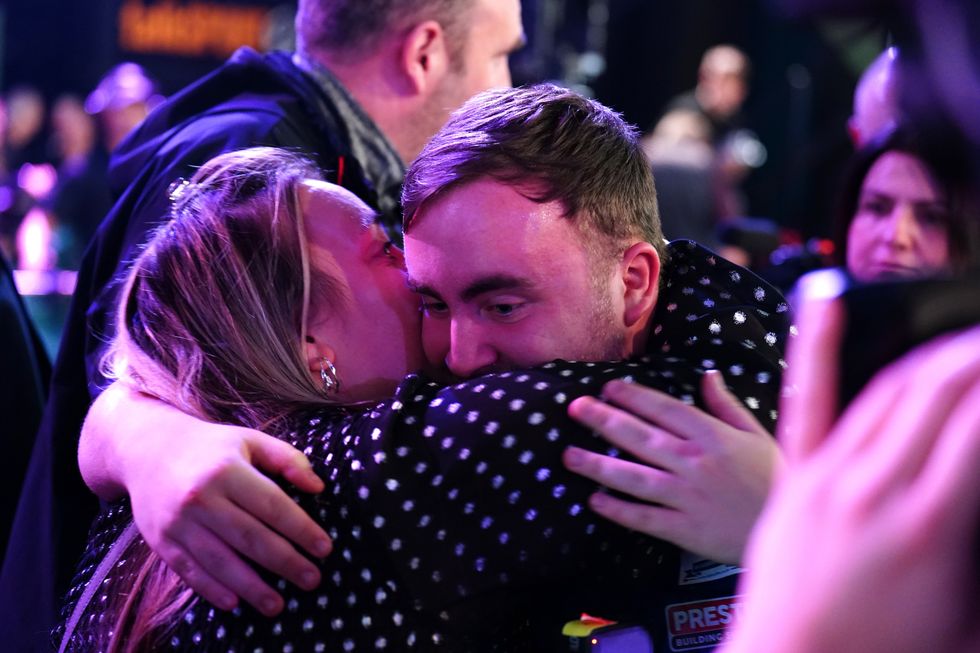 Luke Littler embraced his mother after his win