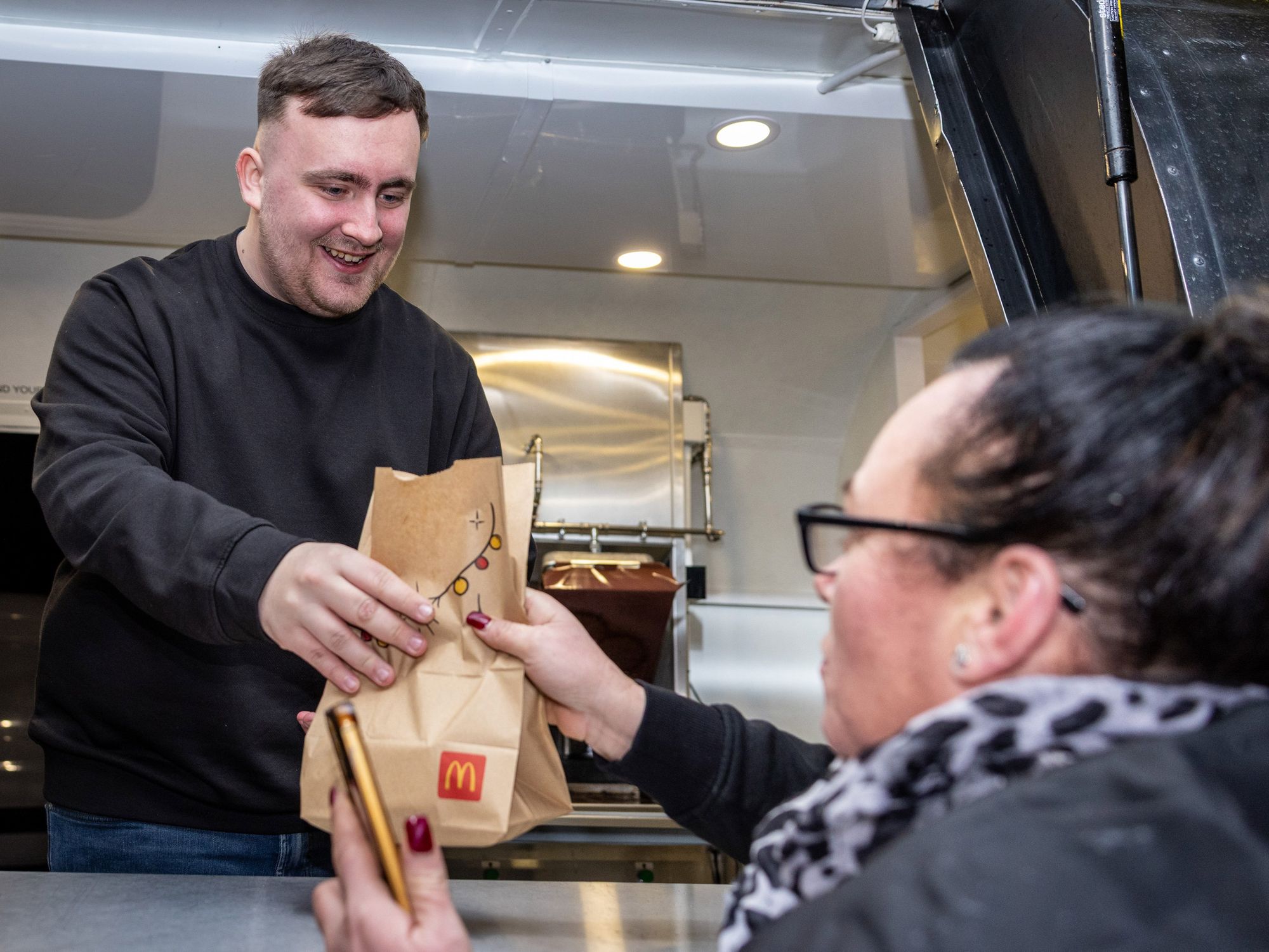 Luke Littler hands out new McDonald’s burger