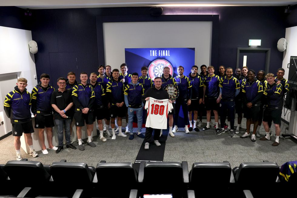 Luke Littler received a signed England shirt with the number 180 printed on the back