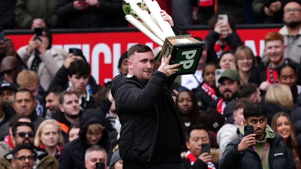 Luke Littler showcased his World Darts Championship silverware on the Old Trafford turf during Saturday's Premier League clash between Manchester United and Tottenham, which ended in a 2-0 triumph for the hosts