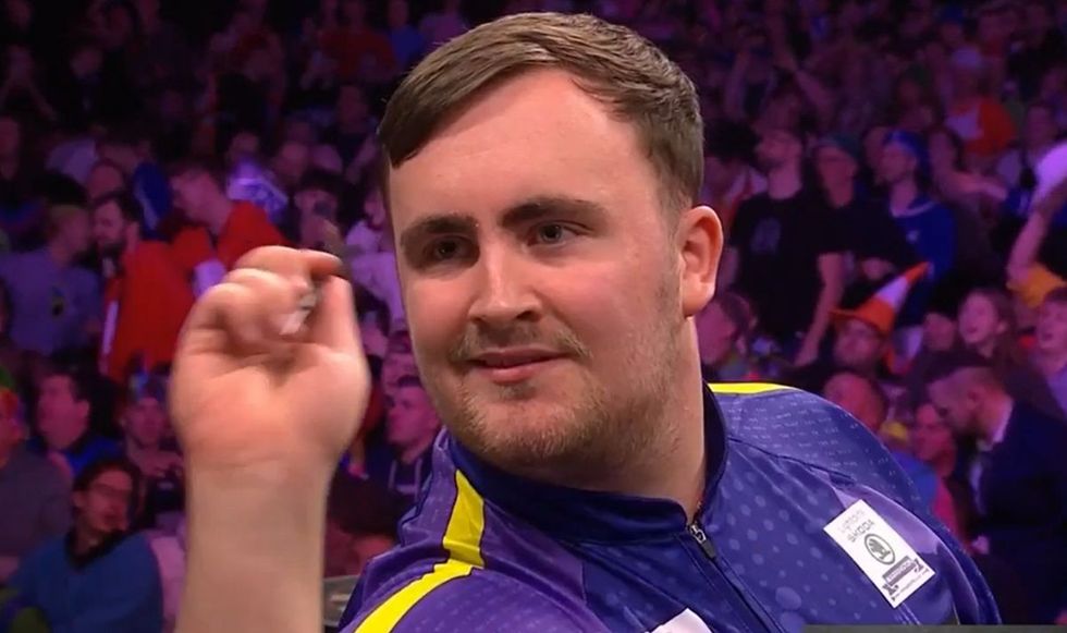 Luke Littler smiled after missing the nine-darter attempt