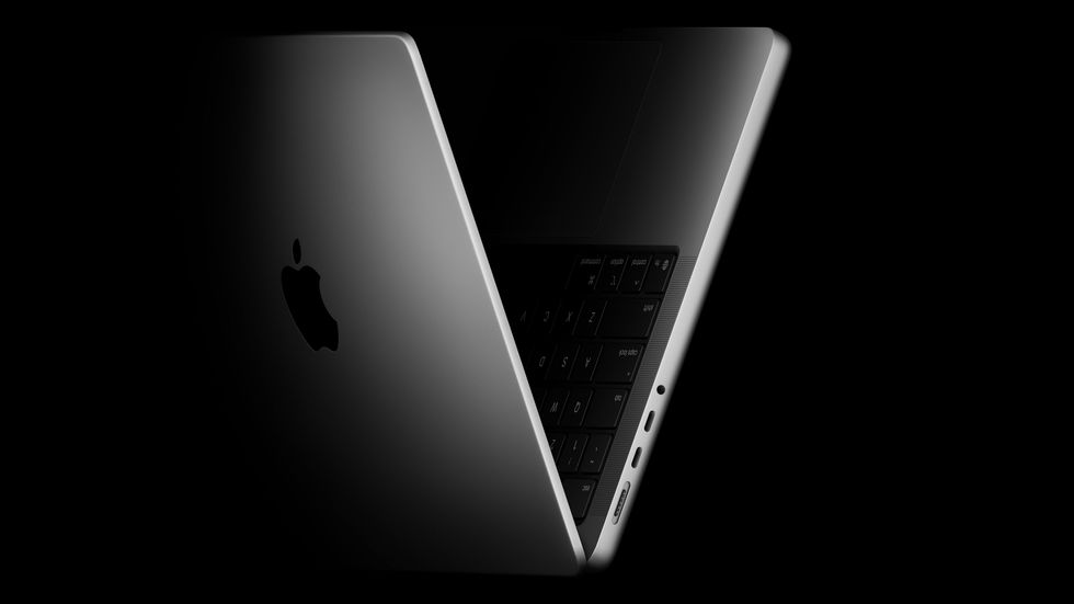 MacBook Pro 14 on its side in a V shape