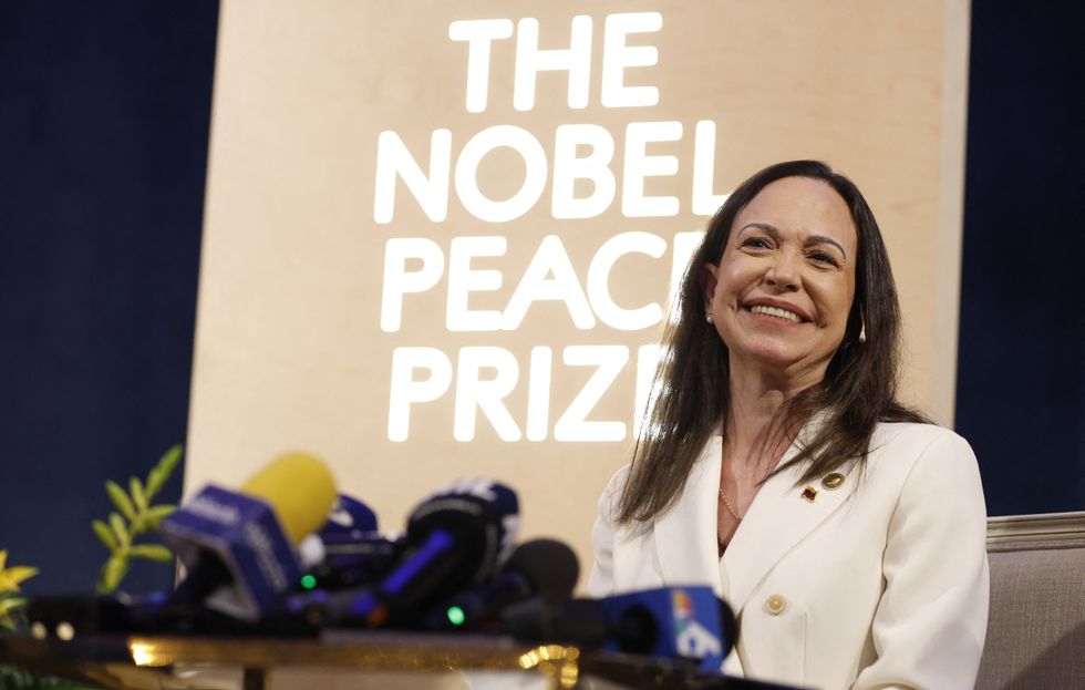 Machado collecting her Nobel Peace Prize medal