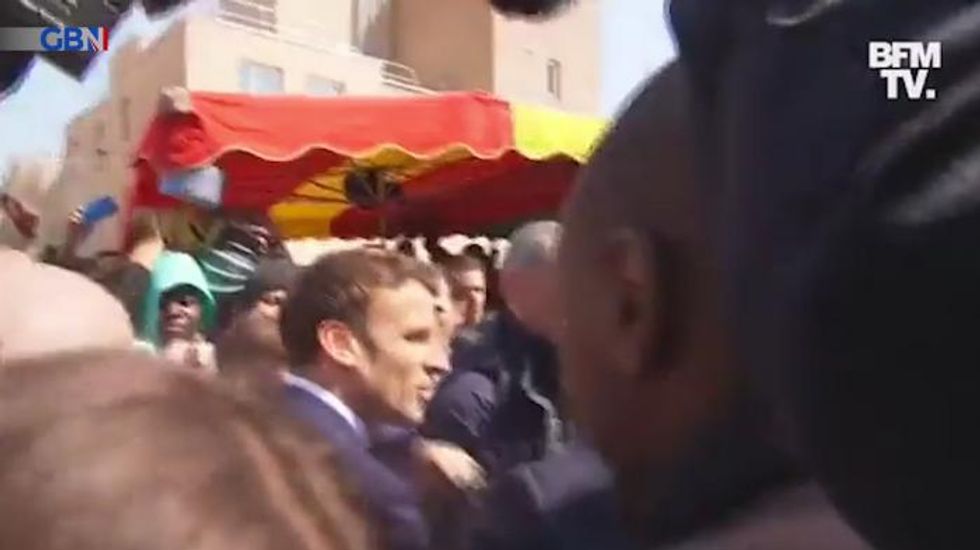 Emmanuel Macron is pelted with tomatoes during first trip since re-election – VIDEO
