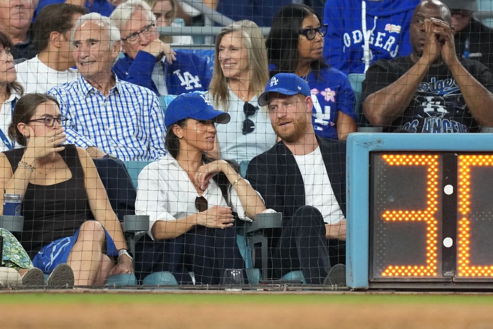 Magic Johnson (right) and Sandy Koufax (left) were relegated to the second row at the fixture