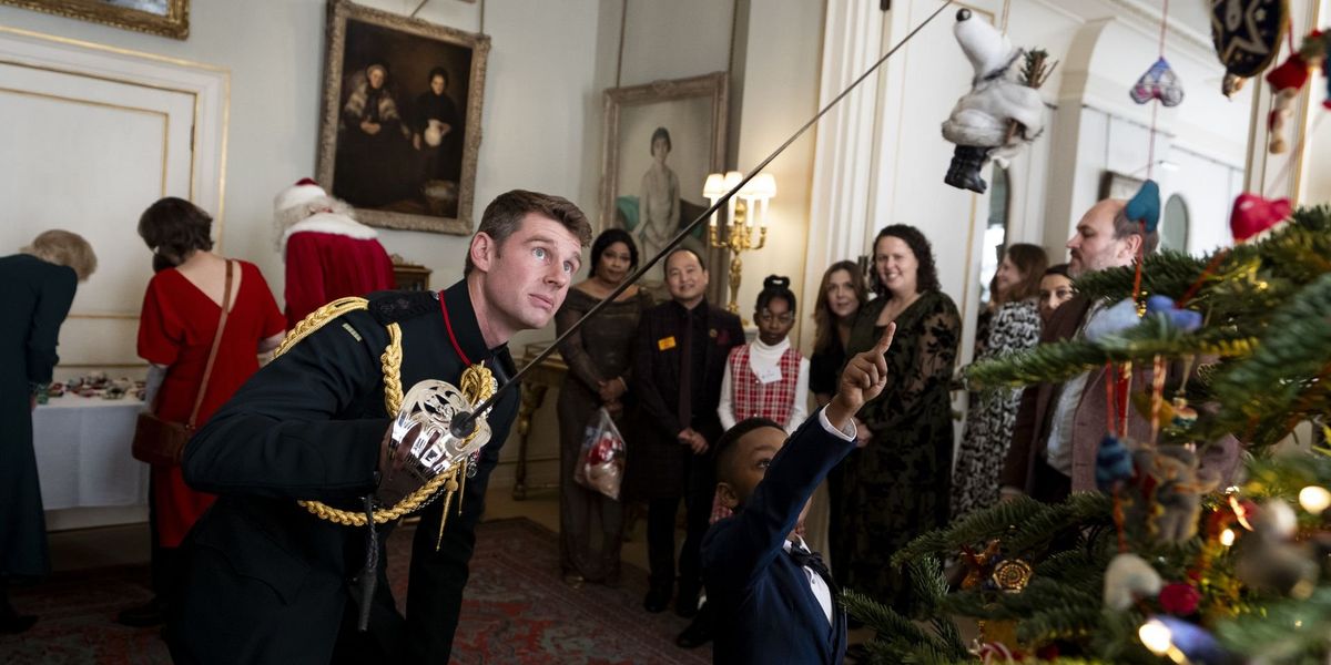 Queen Camilla’s new equerry settles into role as he helps children decorate Christmas tree Queen Camilla’s new equerry settles into role as he helps children decorate Christmas tree