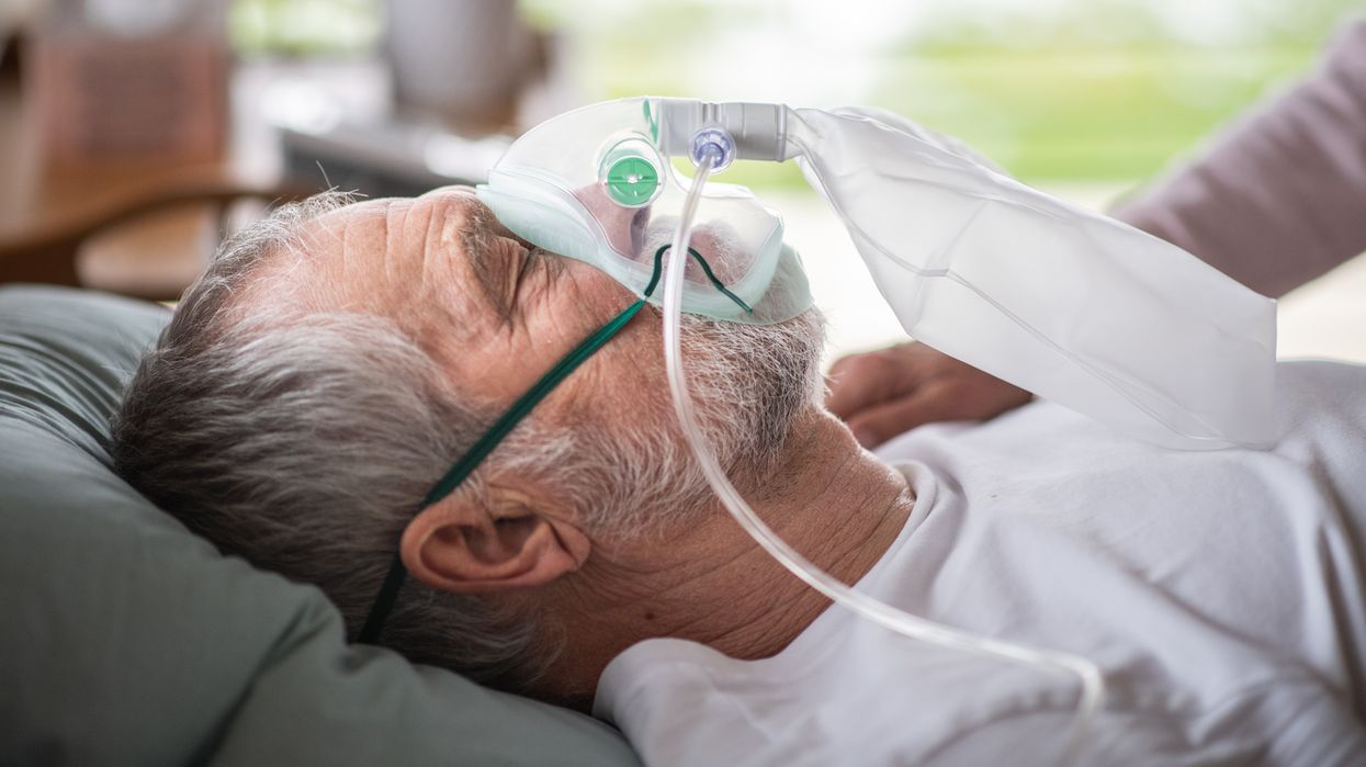 MALE RECEIVING OXYGEN